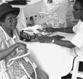 A Barbadian senior gets screened for hypertension.