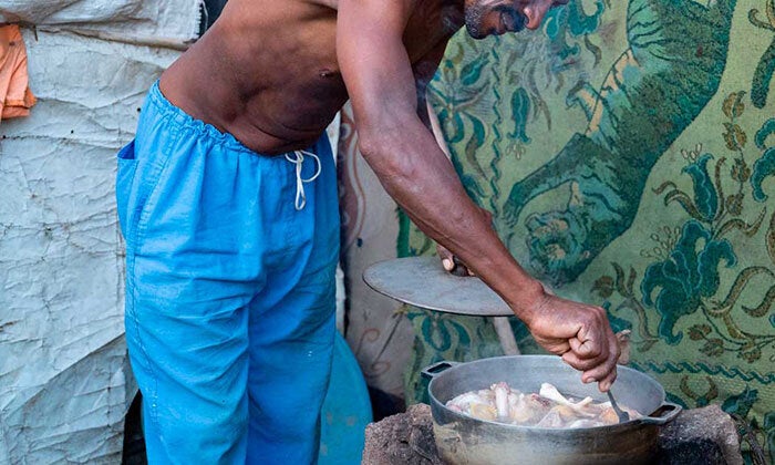 Man cooking with fuel