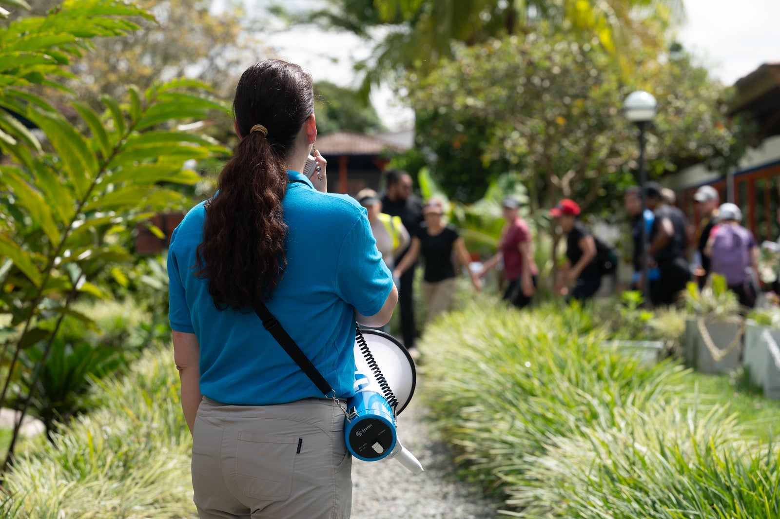 Woman using a megaphone during emergency medical training