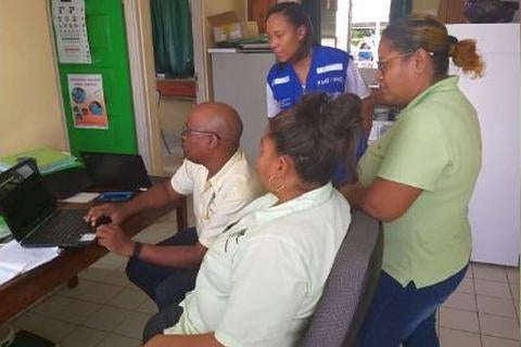 Leah Richards, HSS Advisor of PAHO in Suriname monitors new digital technology to manage patients