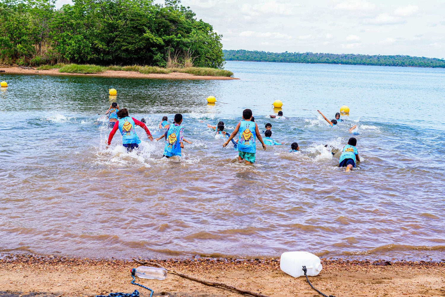 Children play in the water after safety lessons