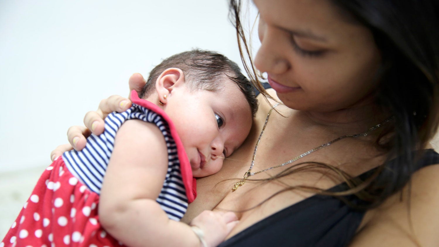 Mother holding baby in arms