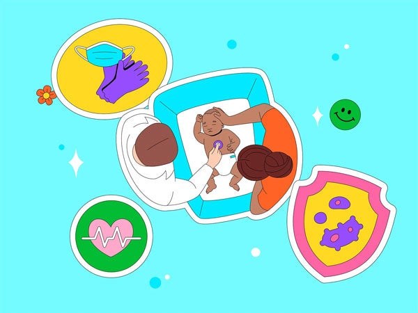 Newborn baby being examined by doctor with mother watching