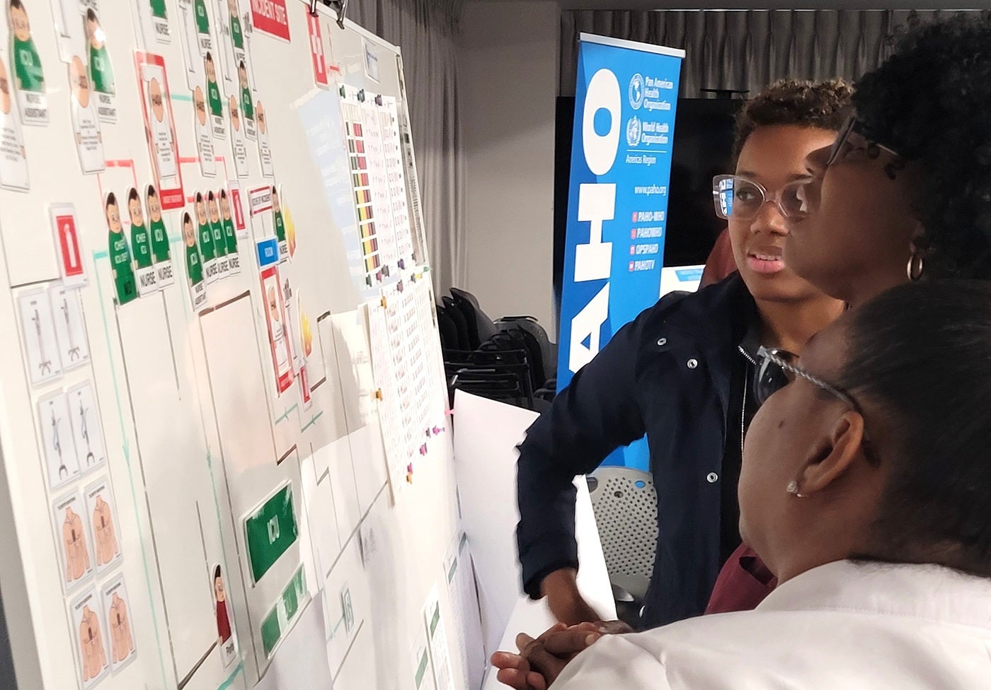 Participants in deep discussion during the Hospital Evacuation exercise