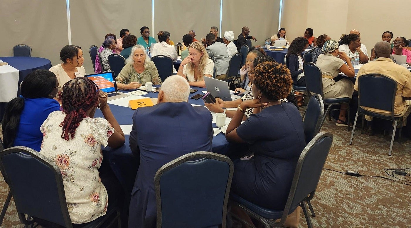 Participants engaged in discussion at the Aging with Dignity” Conference in Sint Maarten