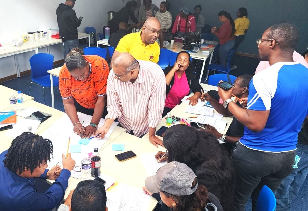 Workshop participants fully engaged in the tabletop exercise