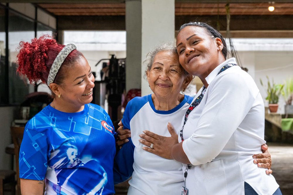 Elisa Margot Rodríguez de Longa, 76, with Vanessa Robayna (right), vaccination coordinator for the parishes of La Guaira, Macuto and Caraballeda. Vanessa is among a new generation of health workers carrying forward the vaccination work Elisa helped strengthen during her decades of service