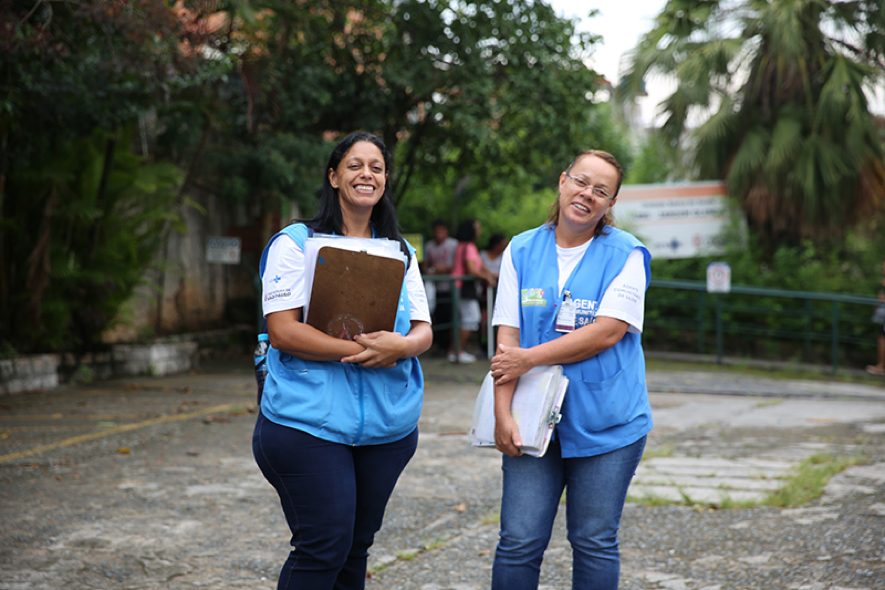 The household cards-called senhas (Portuguese for 'password')-are delivered by community health workers like Irene Anunciação Pereira Silva and Vanuza Martins Cordeiro.