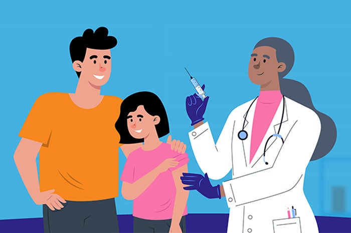 Padre e hija en oficina médica. La niña recibirá una vacuna.