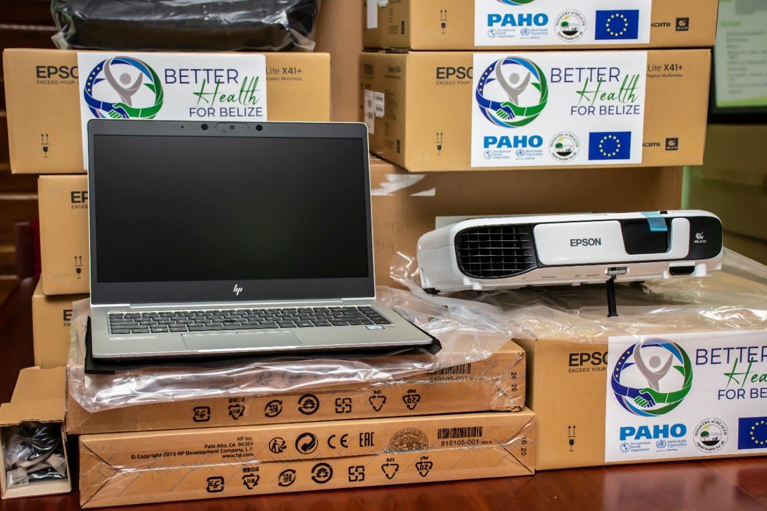 Laptops and projectors donated to the Ministry of Health and Wellness for training