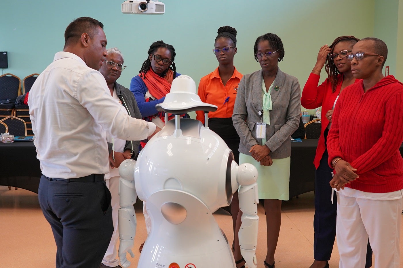 Dr Jorrel Bisnath, Assistant Professor | Mechanical Engineering, Manufacturing and Entrepreneurship at The University of Trinidad and Tobago conducts a demonstration for participants of the Humanoid Health Service Robot training for the Tobago Regional Health Authority.