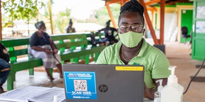Health worker behind computer