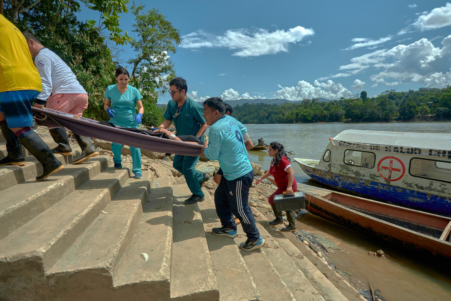 Healthcare professionals and community agents transferring patient