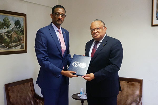 Senator the Hon Jerome Walcott, presented a gift to Dr Yitades Gebre
