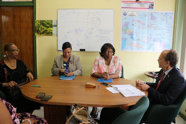 Dr. Etienne and staff meet with CARPHA Director