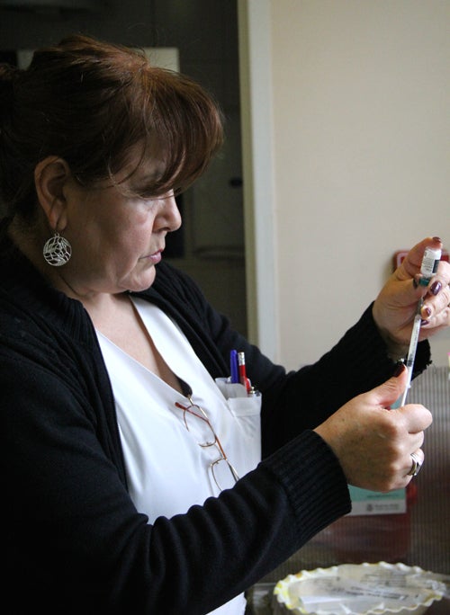 Dr. prepares vaccine