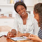 mother and girl doing homework