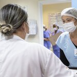 Two healh workers in a health care facility