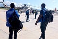 Team of PAHO/WHO experts boarding UNASS helicopter to the South of Haiti following eathquake.