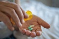 Woman holds antibiotics on her hand