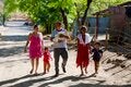 family walking down a dirt road