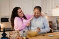 Mother and daughter cooking together