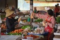 Women interacting in an open market