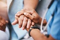 Health worker holding the hand of a patient