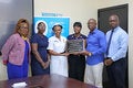 Handover the Baby-Friendly Hospital accreditation plaque to officials in Grenada