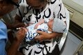 women holding baby