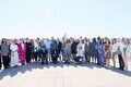 attendees from the meeting standing at a terrace