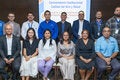 Fotografía grupal de los miembros de la instituciones participantes en la mesa de conversatorio sobre calidad del aire