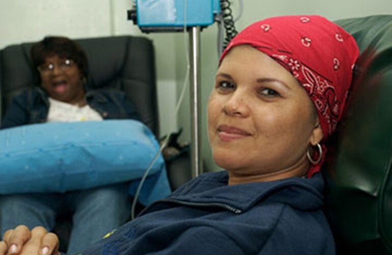 woman with bandana smiling