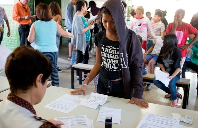 A teenager registers to receive the HPV vaccine
