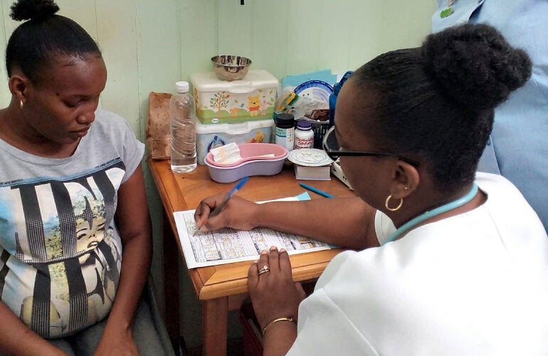 Pregnant woman receiving prenatal care
