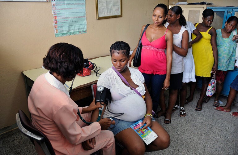 pregnant woman has her blood pressure monitored