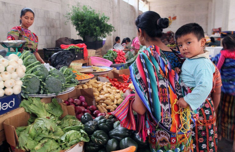 Indigenous moher and child in market