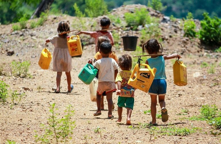 children retrieving water