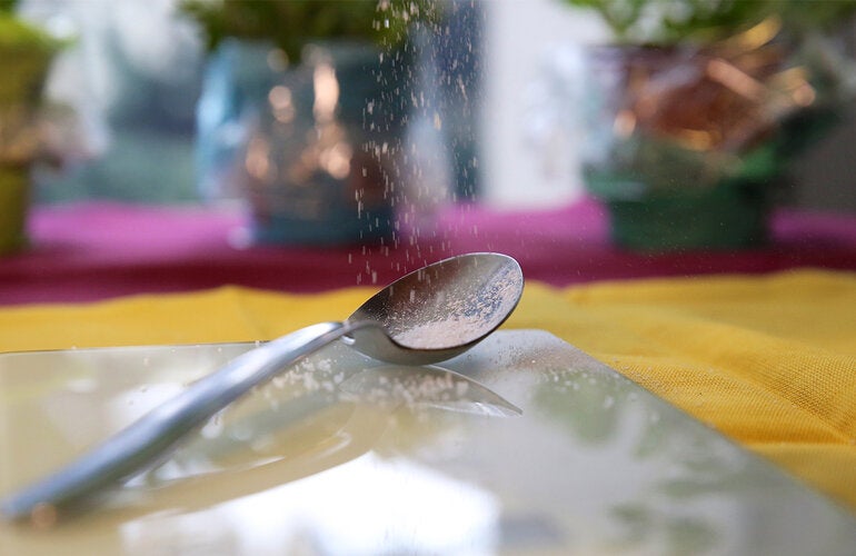 Salt falling over a spoon