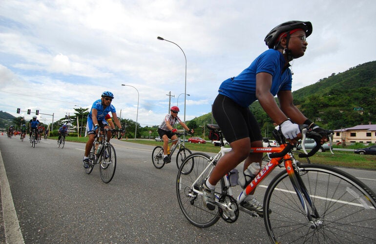 People riding bicycles on a road