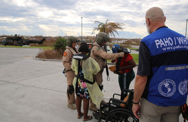 Dutch Military assist a pregnant woman. 