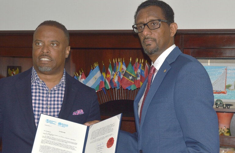 Dr Yitades Gebre (right) PAHO/WHO Representative to Barbados and the Eastern Caribbean Countries, presented his credentials to Minister Mark Brantley - Premier and Minister of Health - Nevis and Minister of Foreign Affairs, St Kitts and Nevis