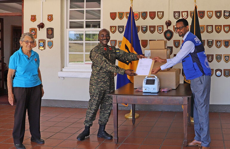 Dr Yitades Gebre presenting ventilator to BDF