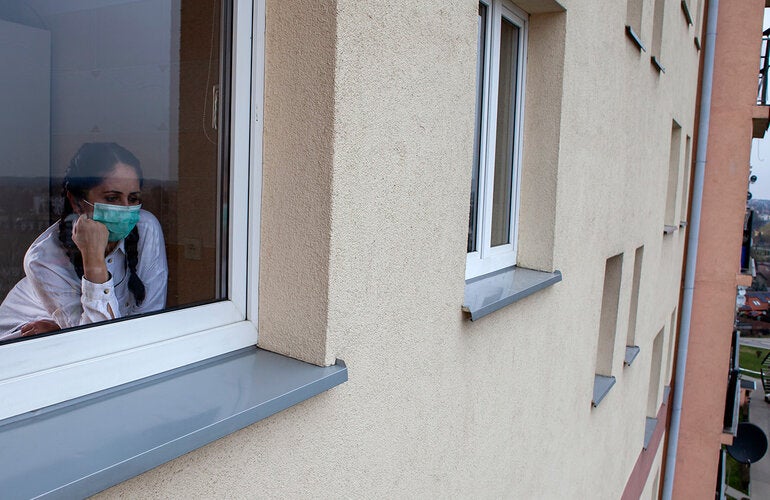 Woman looking out the window
