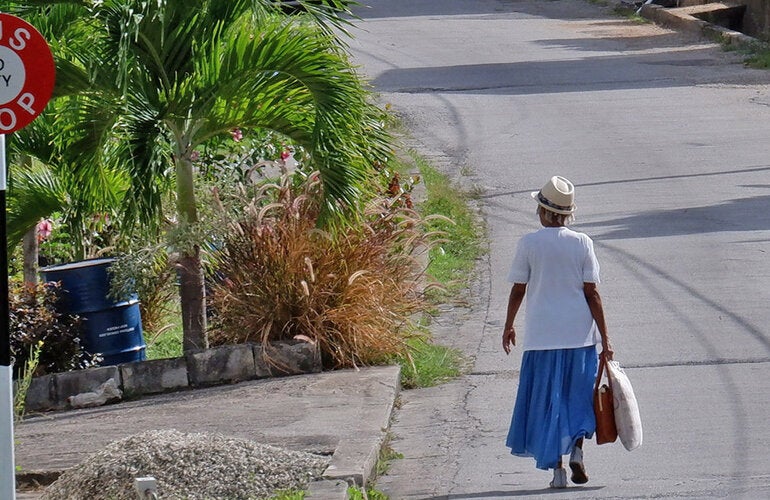 Elderly woman walking in Barbados