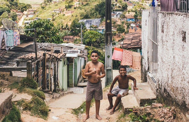boys standing on unpaved street