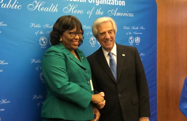Carissa F. Etienne congratulates former Uruguayan President Tabaré Vázquez