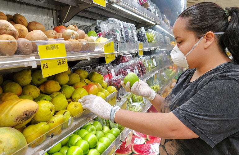 Woman buying fruit in a supermarket
