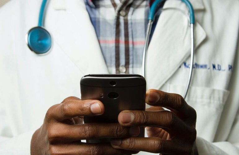 Doctor using cell phone