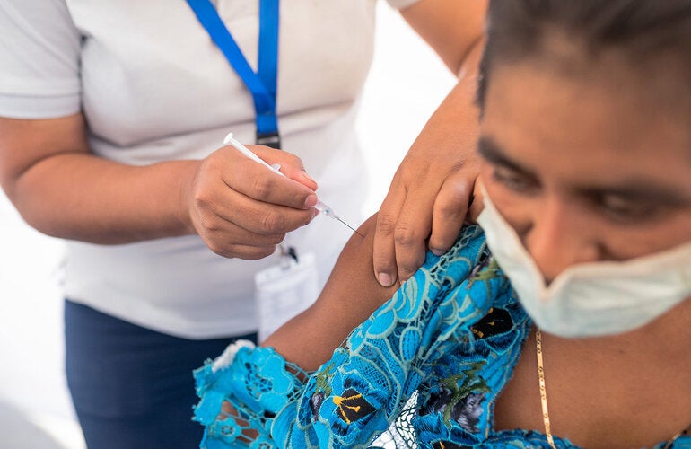 WOman is vaccinated against COVID-19 in Guatemala